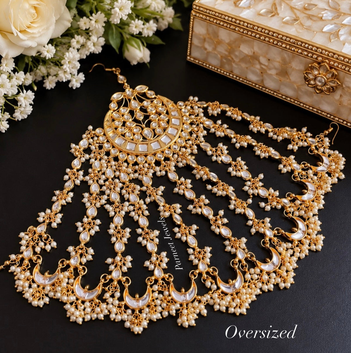 Oversized gold-tone kundan passa with pearl-chain detailing by Parneet Jewels