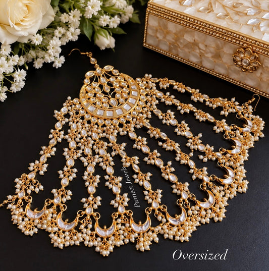 Oversized gold-tone kundan passa with pearl-chain detailing by Parneet Jewels